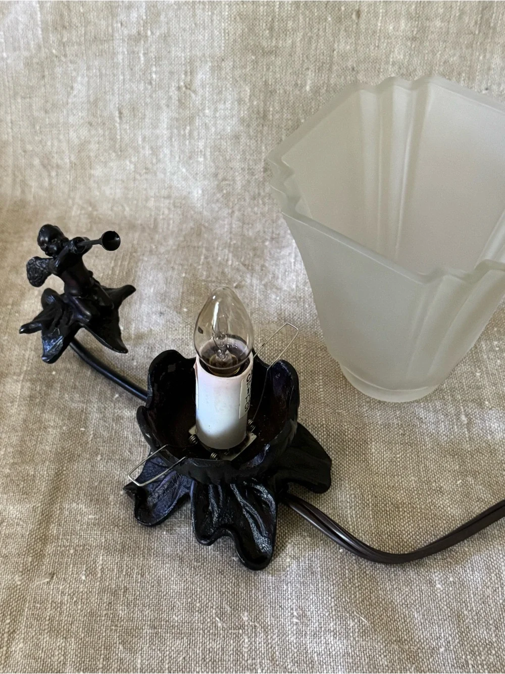 Vintage style cast metal cherub lamp